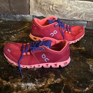 On Running Red and Pink Athletic Shoes with Cloud Cushioning